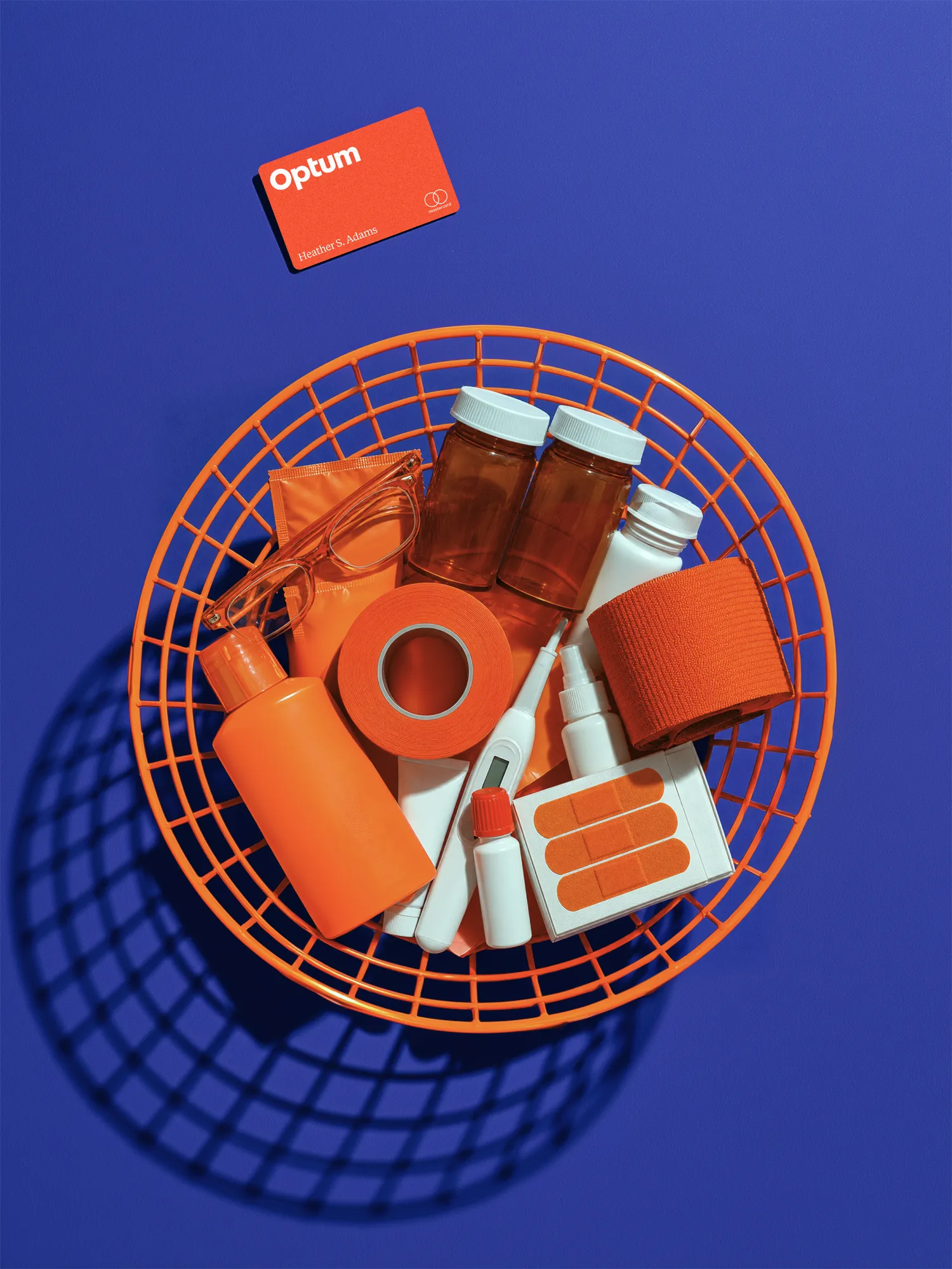 Optum card and everyday health products in an orange shopping basket.