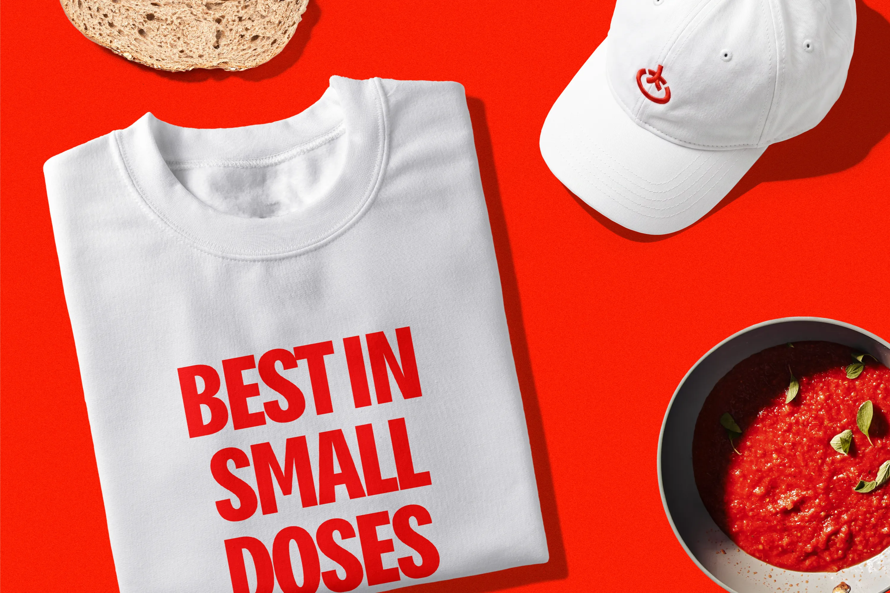 Toomato shirt reading Best in small doses and branded cap.