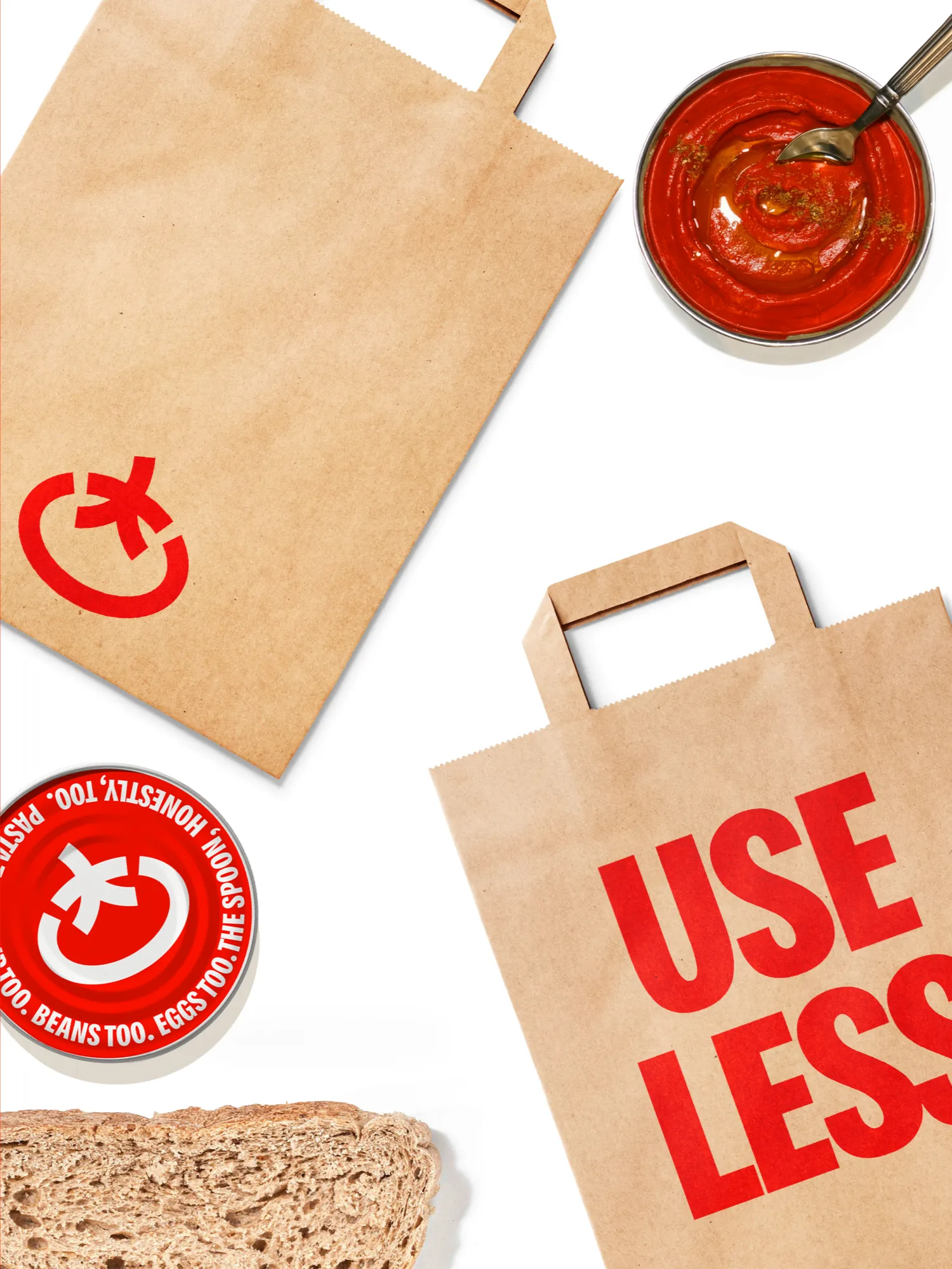 Toomato paper bags with Use less messaging.