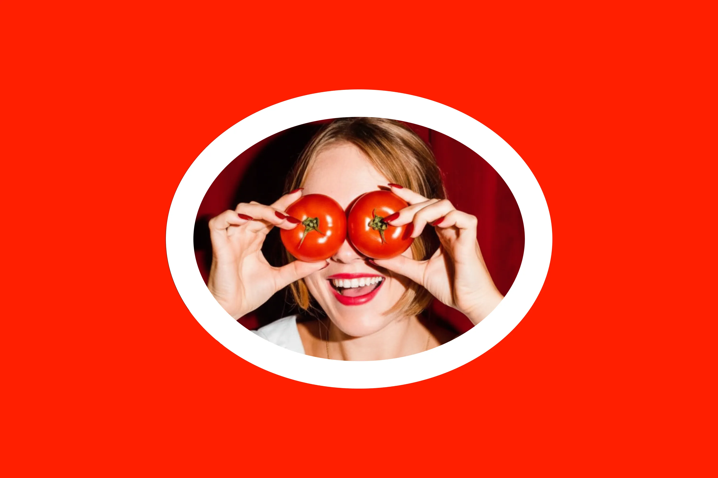 Portrait framed by the Toomato ring with tomatoes held over the eyes.